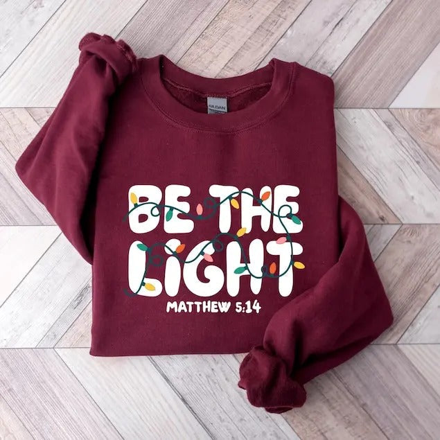 Be The Light Sweatshirt, Religious Christmas hoodie, Christian Holiday Sweater, Faith Based Gift, Christmas Gifted, Festive Apparel  T-shirt, sweater and Hoodie