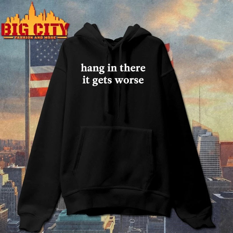 Kirk Henderson wearing Hang In There It Gets Worse shirt